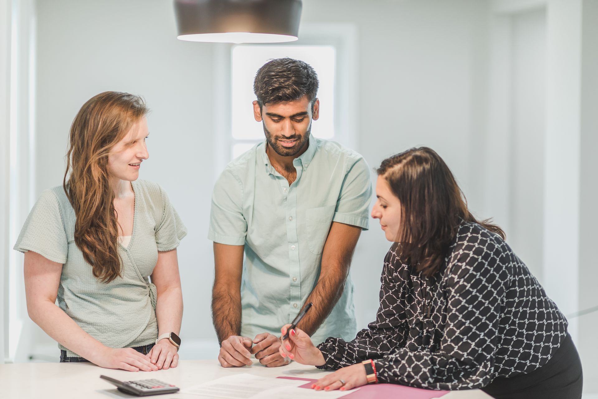 Colleagues talking in an office